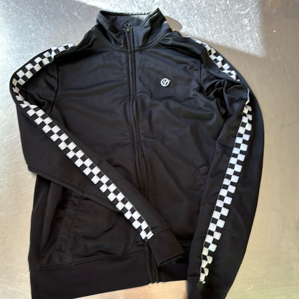 Vans boys zip up track jacket. Size xs. Black with pockets. Used good condition